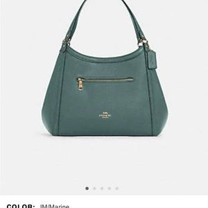 Brand new coach purse and matching wallet, color is marine